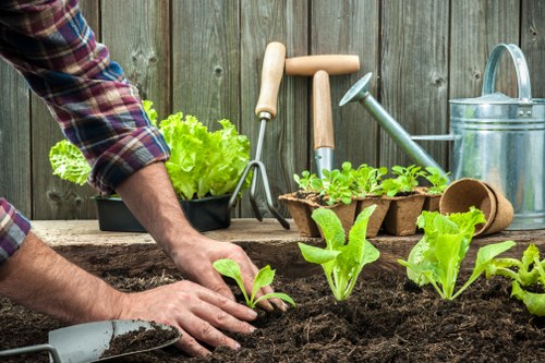 Volunteers loading reusable plant pots for charity redistribution