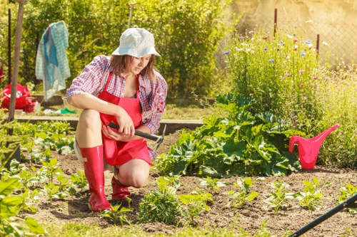Front view of a gardener starting work in a residential garden